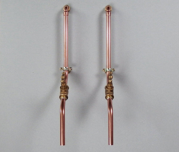 pair of industrial wall mounted taps made in solid copper pipe and brass valve suitable for bathroom sink