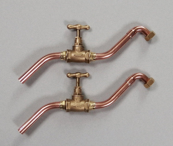 pair of minimalist wall mounted taps made in solid copper pipe and brass valve suitable for bathroom or kitchen  sink 