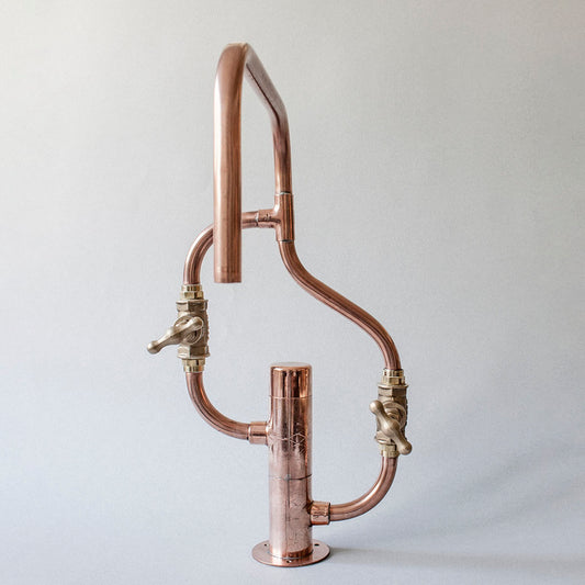 Pedestal Wave is a copper faucet crafted from exposed piping and brass, designed for kitchen or bathroom sink, suitable for outdoor use, by Switchrange.