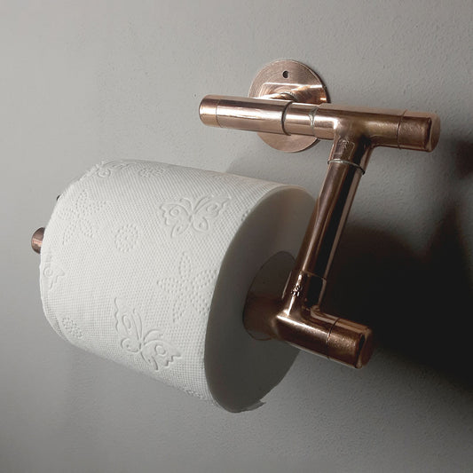 This is a handmade copper toilet paper  holder made by Switchrange.