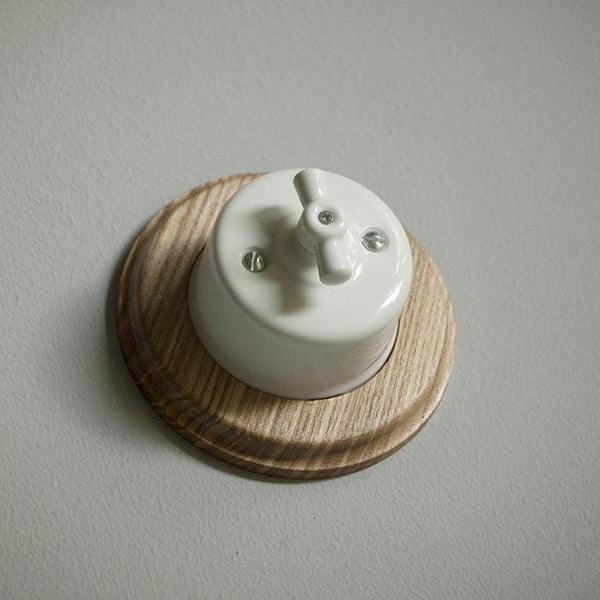 Wooden period ornament for rotary wall switch